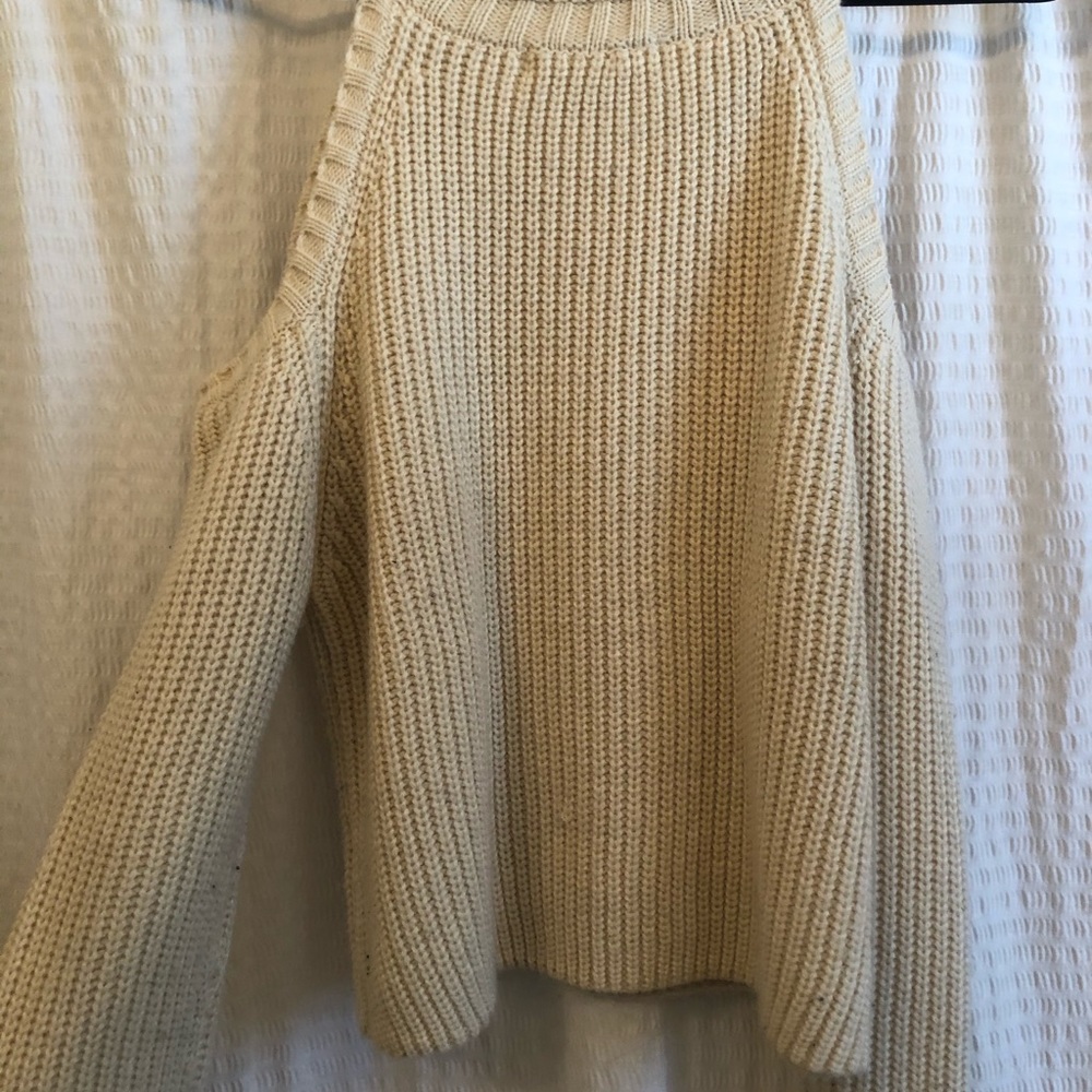 Cream colored, stylish sweater